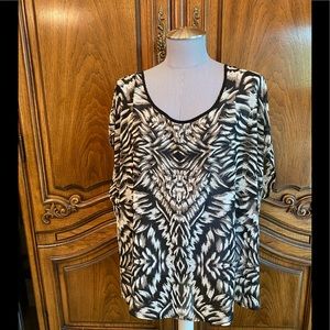 Torrid open back sleeveless top.